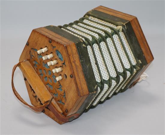 A 21-button Concertina Superior, possibly German, with fret-cut ends (faults, no case)